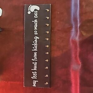 Black medal holder sign